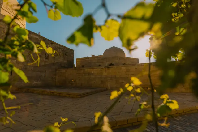 The Palace of the Shirvanshahs seen through leaves