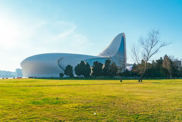 The curving white Heydar Aliyev Centre beyond a lawn