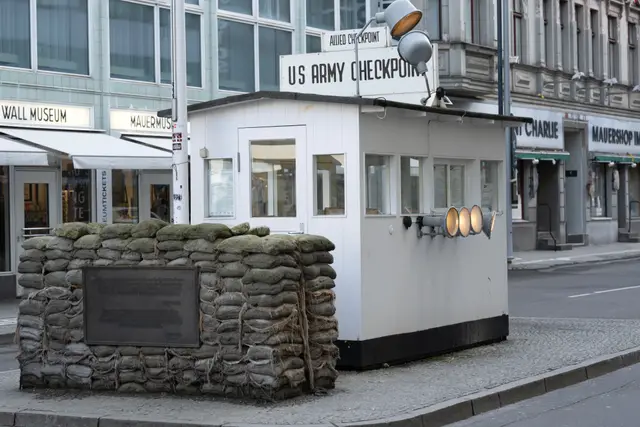 The sandbagged guard hut and US Army Checkpoint sign at Checkpoint Charlie
