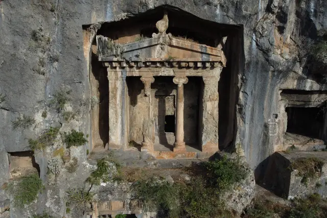 The Tomb of Amyntas, a temple façade with Ionic columns carved into the cliff