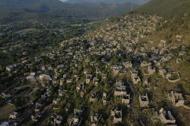 Kayaköy from the air: roofless stone houses spread across the hillside