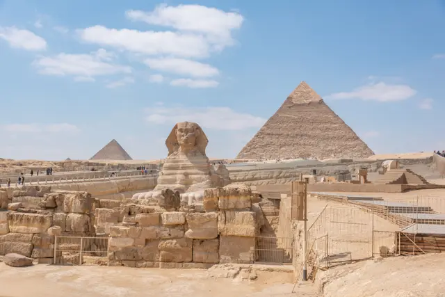The Great Sphinx with the Giza pyramids behind