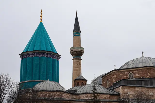 The turquoise dome and minaret of the Mevlana Museum