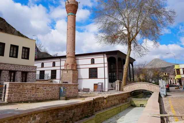 A historic minaret and stone bridge in Sille