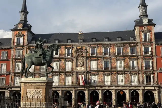 The equestrian statue of Philip III in Plaza Mayor, with the frescoed Casa de la Panadería behind