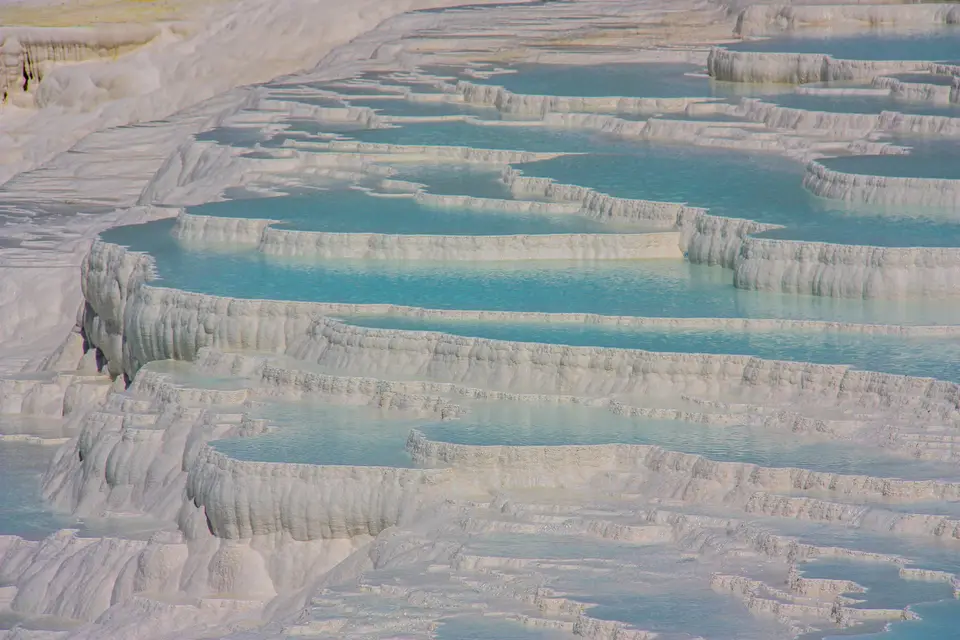 Pamukkale's white travertine terraces and blue pools